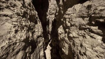 A narrow passage between two large rocks video