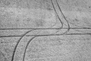 Abstract aerial view of traces on the field. Black and white photo