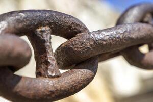 The old and rusted chain. Close up. photo