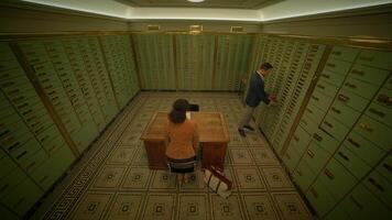 A suspenseful scene unfolds as a man and a woman sit at a table in a bank vault, surrounded by lockers. Intrigue and mystery fill the air as they engage in a secretive conversation video