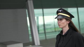 Young Successful Female Airline Captain Pilot Preparing for Flight at Airport video