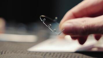 Close-up of a dental wire, A close-up shot of a hand holding a dental wire, showcasing the intricate details and craftsmanship involved in creating orthodontic devices video