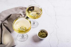 Refreshing green matcha martini in glasses on the table photo