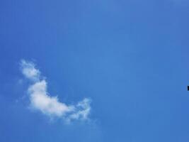 Bright blue sky with white clouds in the morning photo