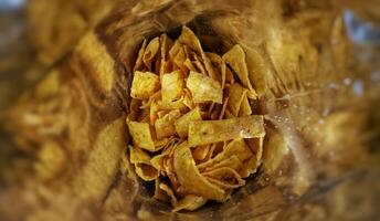 close up of tortila chips in the bag photo