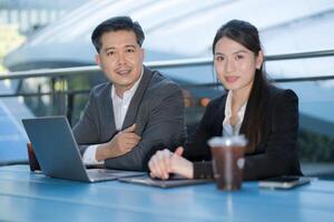 Professional business team working outdoors photo