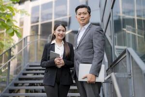 Professional business team on corporate stairway photo