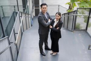 Confident business team on office stairs photo