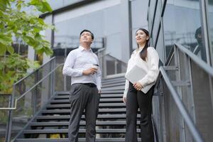 Confident business colleagues on staircase photo