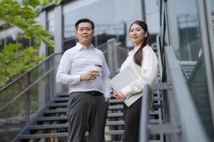 Confident business colleagues on staircase photo