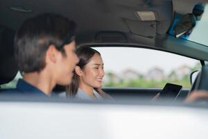 Smiling man in passenger seat on a road trip photo