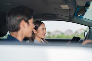 Smiling man in passenger seat on a road trip photo