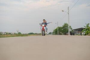 Joyful couple on motorcycle adventure photo