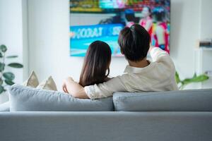 Cozy couple enjoying movie night at home photo