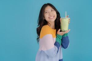 Young woman enjoying bubble tea photo