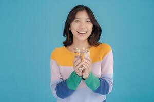 Cheerful woman holding a glass of water photo