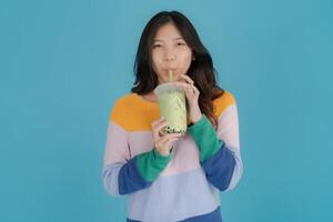 Young woman enjoying bubble tea photo