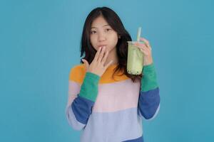 Young woman enjoying bubble tea photo