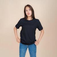 Young woman in casual black t-shirt and jeans photo