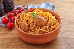 Spaghetti with meatball in tomato sause photo