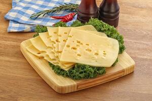 Sliced maasdam cheese for breakfast photo