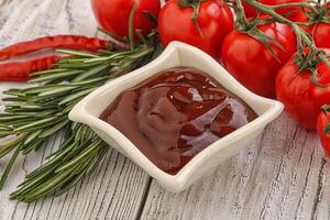 Tomato barbecue sauce on the bowl photo