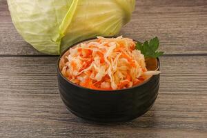 Sauerkraut - pickled cabbage in the bowl photo