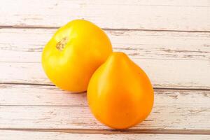 Ripe yellow bright juicy tomato photo