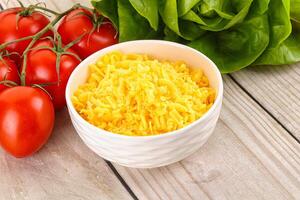 Shredded cheese in the bowl photo