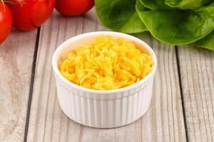 Shredded cheese in the bowl photo