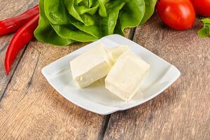 Greek traditional Feta cheese in the plate photo