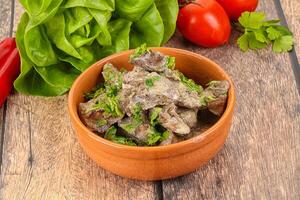 Chicken liver with cream sauce photo