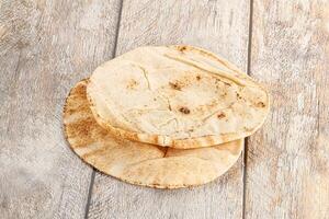 Traditional eastern round pita bread photo