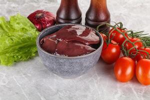 Raw turkey liver in a bowl ready for cooking photo