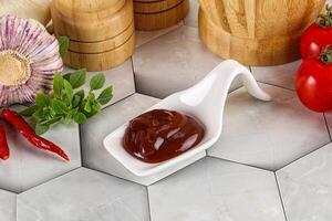 Tasty barbecue sauce in the bowl photo