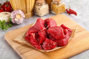 Sliced raw beef meat for cooking photo