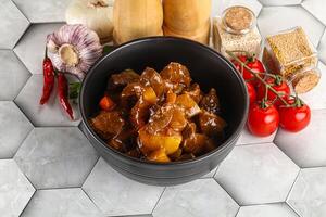 Homemade beef hungarian goulash with potato photo