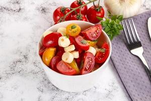 Italian Caprese salad with tomato and mozzarella photo