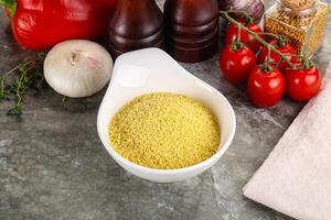 Raw dry wheat couscous grain photo