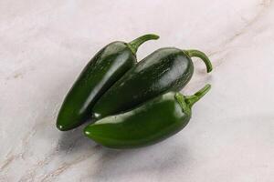 Raw green Mexican jalapeno pepper photo