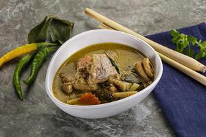 Thai green curry soup with basil photo