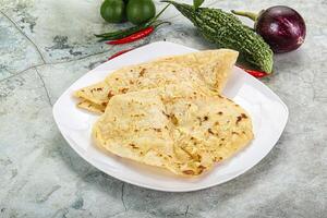 Indian tandori bread - naan with cheese photo