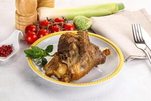 Baked Lamb shank with bone photo