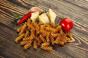 Raw whole grain pasta fusilli photo