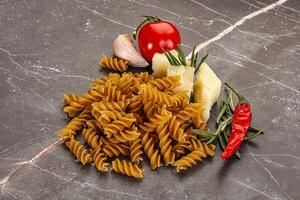 Raw whole grain pasta fusilli photo