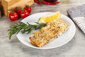 Baked salmon fish served rosemary photo