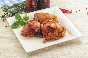 Roasted chicken leg with spicy sauce photo