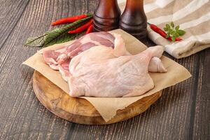 Raw duck leg ready for cooking photo