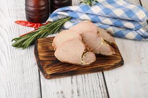 Baked pork tenderloin served rosemary photo