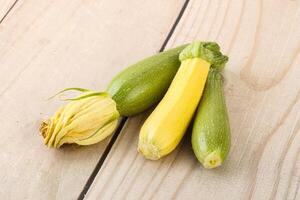 Raw baby organic zucchini heap photo